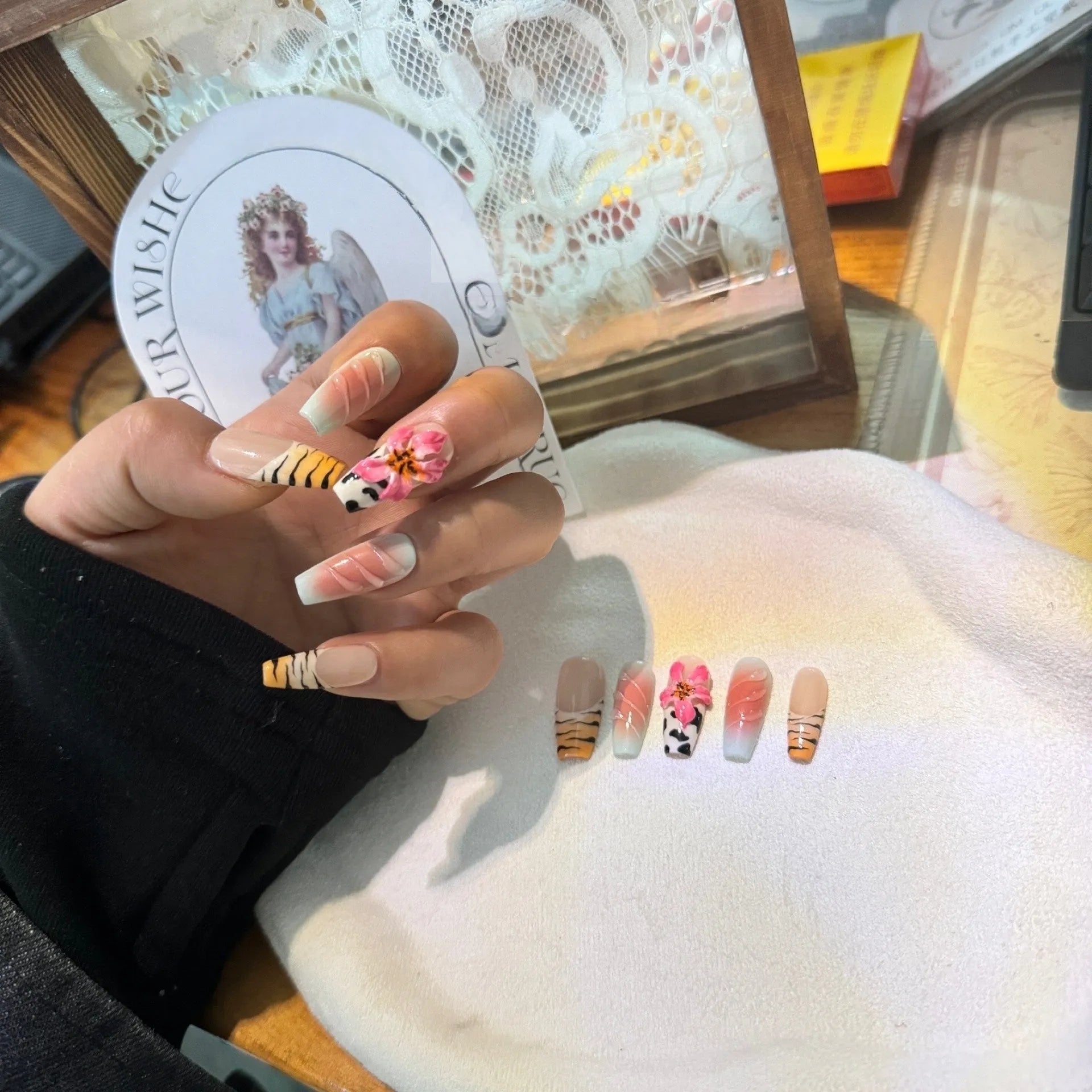 Zebra pattern hand carving nail art with embossed flower and leopard print designs in four sizes