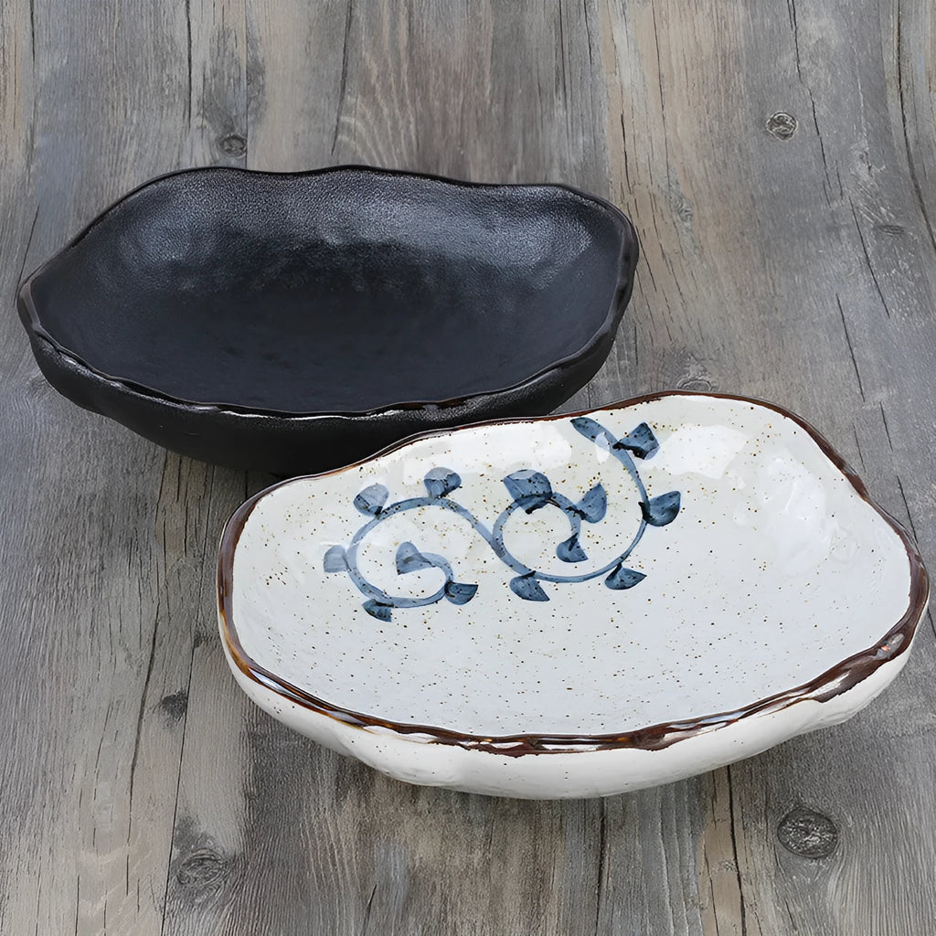Irregular shaped Japanese coarse pottery bowl with floral decoration measuring 24cm length