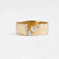 Gold plated copper ring for women with shining zircon detail on a finger.