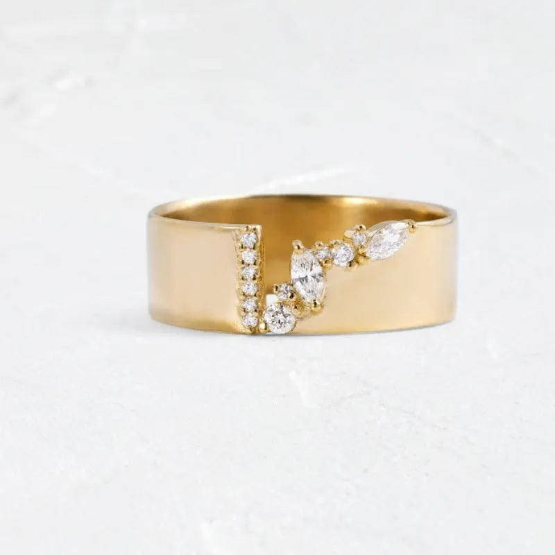 Gold plated copper ring for women with shining zircon detail on a finger.