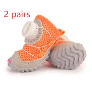 Small dog wearing soft Oxford sole non-slip shoes in blue, side view showing thin bottom