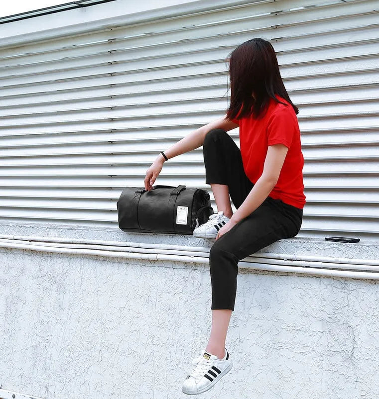 Black waterproof sports bag with shoe compartment and diagonal straps shown in two size options