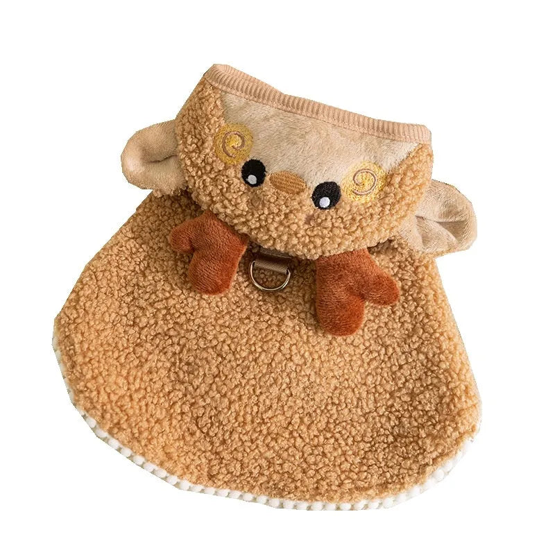 Green granular velvet cat cape with Christmas tree hat and star, lying on a white background