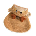 Green granular velvet cat cape with Christmas tree hat and star, lying on a white background