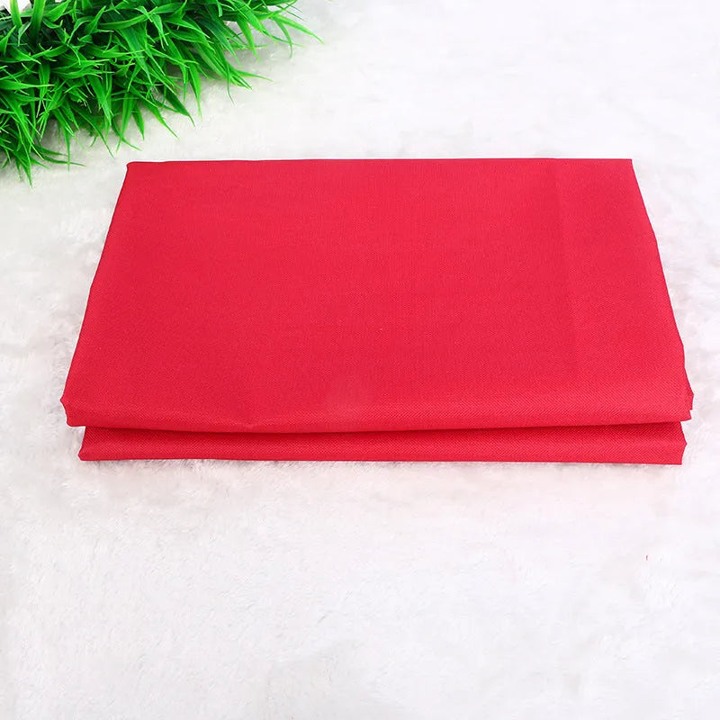 A square red waterproof car pet pad for dogs and cats on a car seat, showing its size and fabric texture.