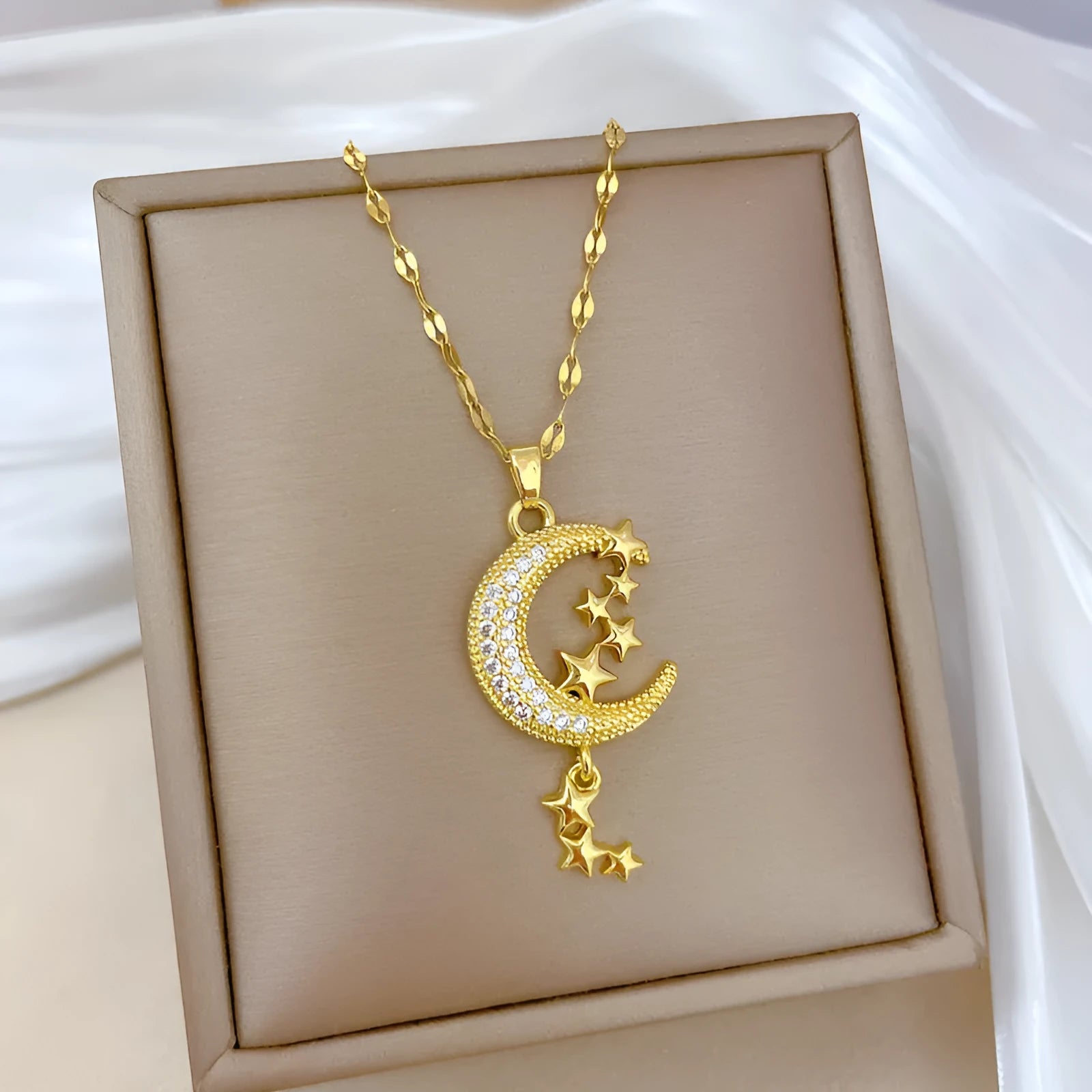 Moon pendant necklace with tassel details on stainless steel chain