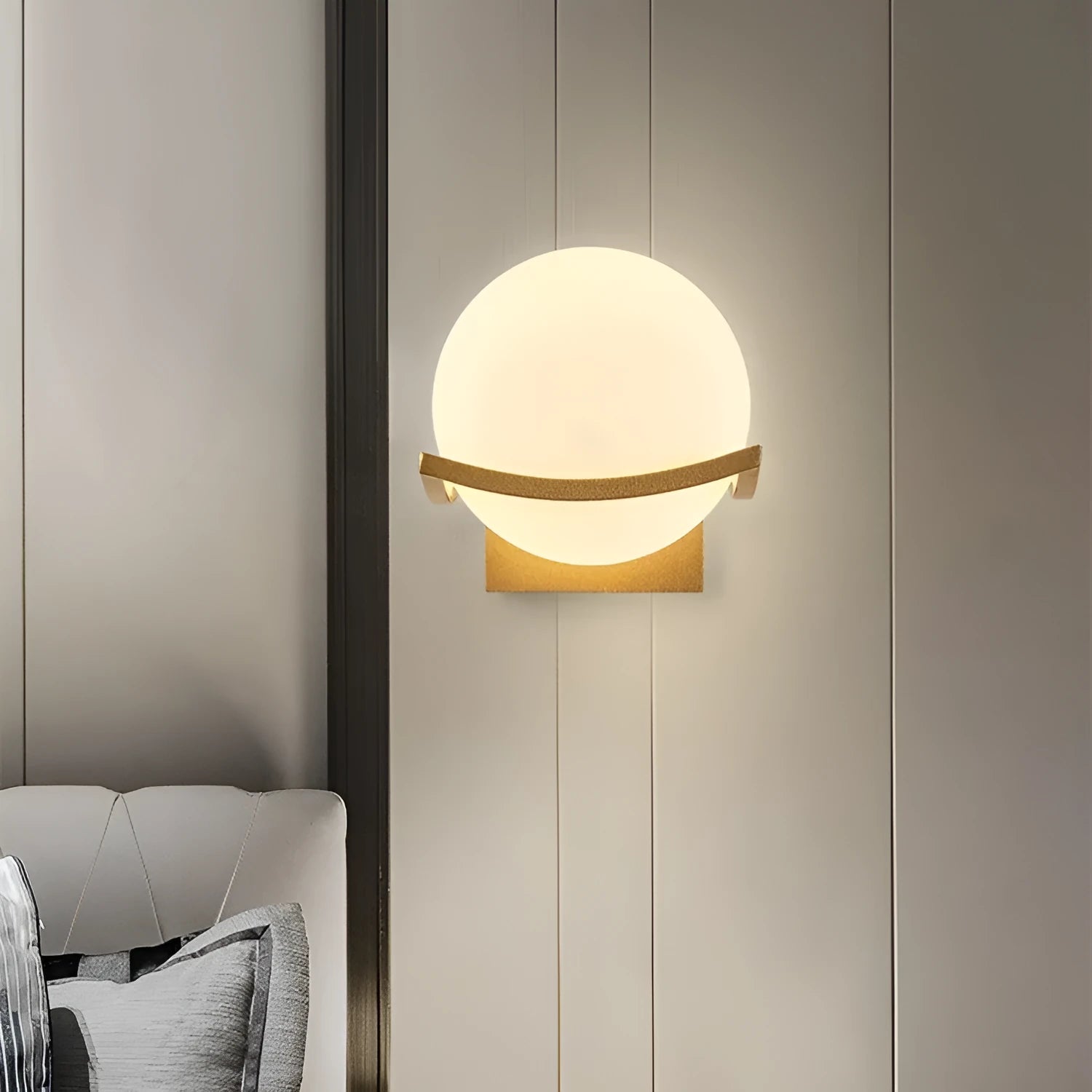 European wall lamp with black base and milky white cover, mounted on bedroom wall
