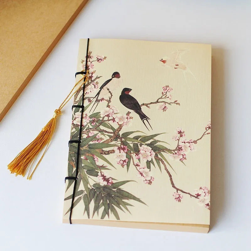 A5 antique thread-bound notebook with embossed cover and decorative tassels