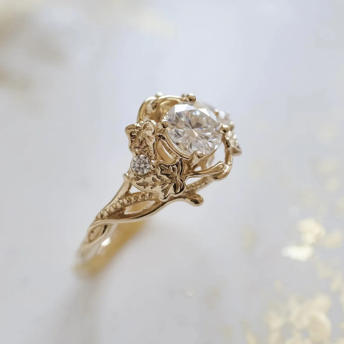 Gold alloy ring with brushed finish on neutral background