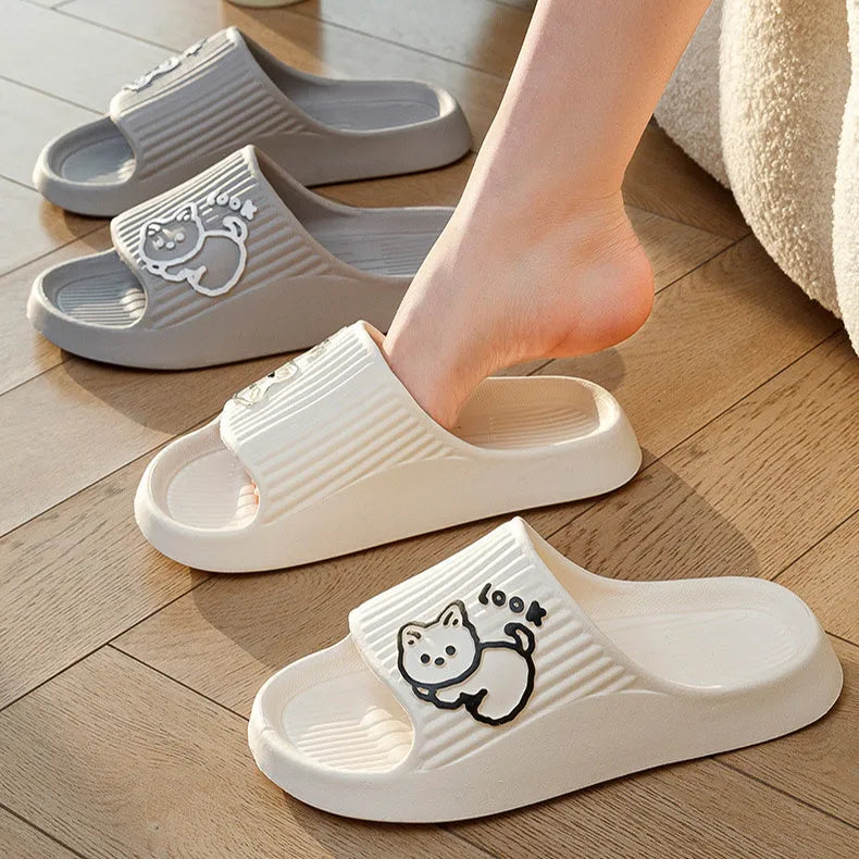 Women's green cat slippers with thick platform sole and flip-flop design.