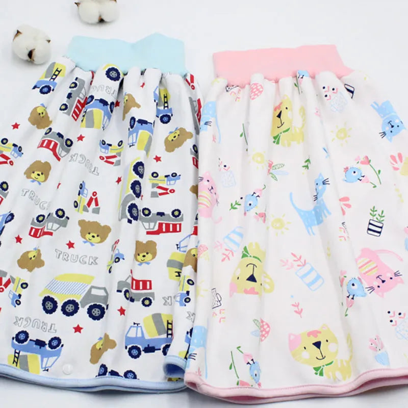 Baby girl wearing a multi-colour waterproof cotton diaper skirt with elastic waistband for belly protection