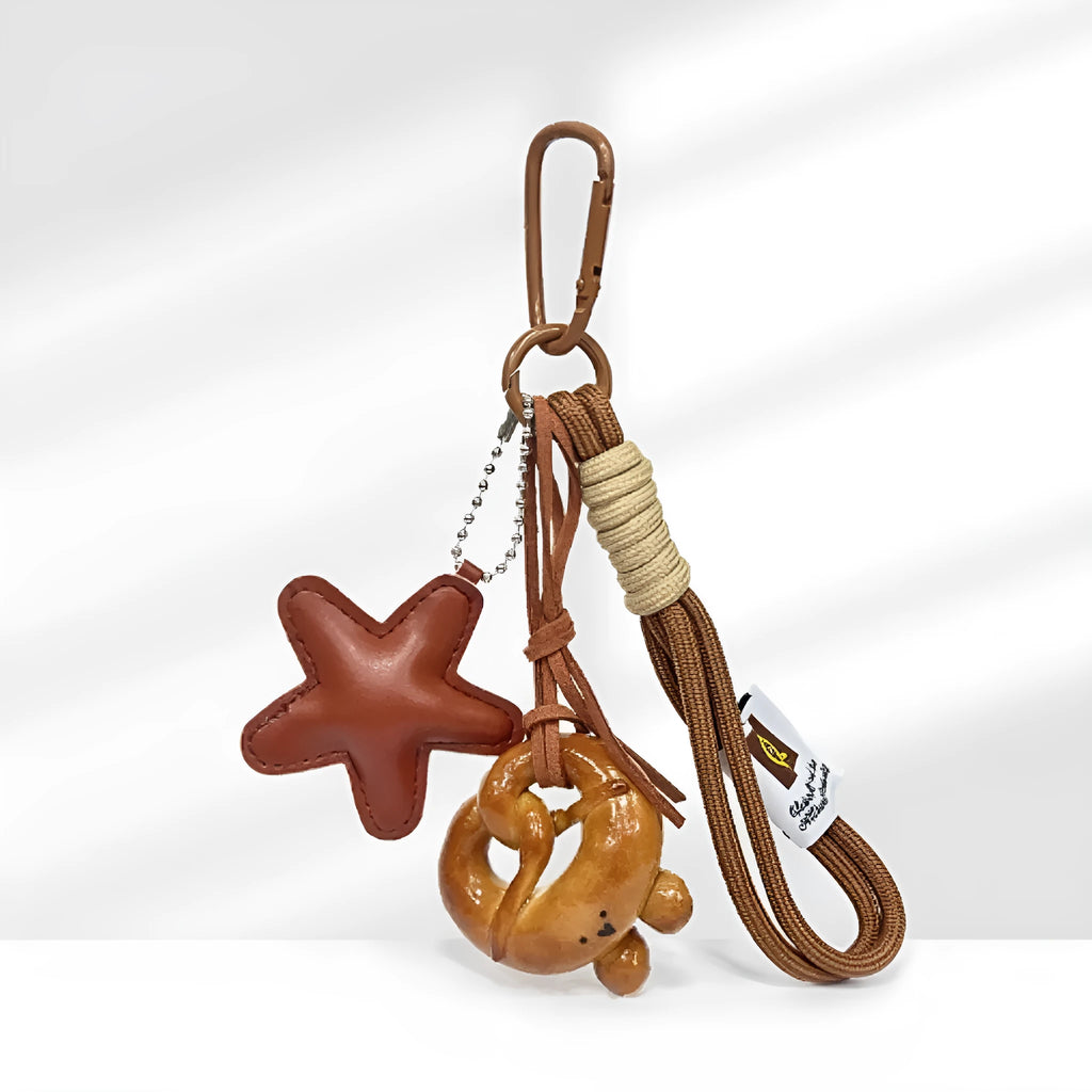 Handmade soda bread handbag pendant with baked varnish finish and brown carrying strap