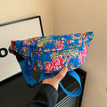 Women's floral Western style waist bag with three-dimensional pocket in black, red, green or blue colour options