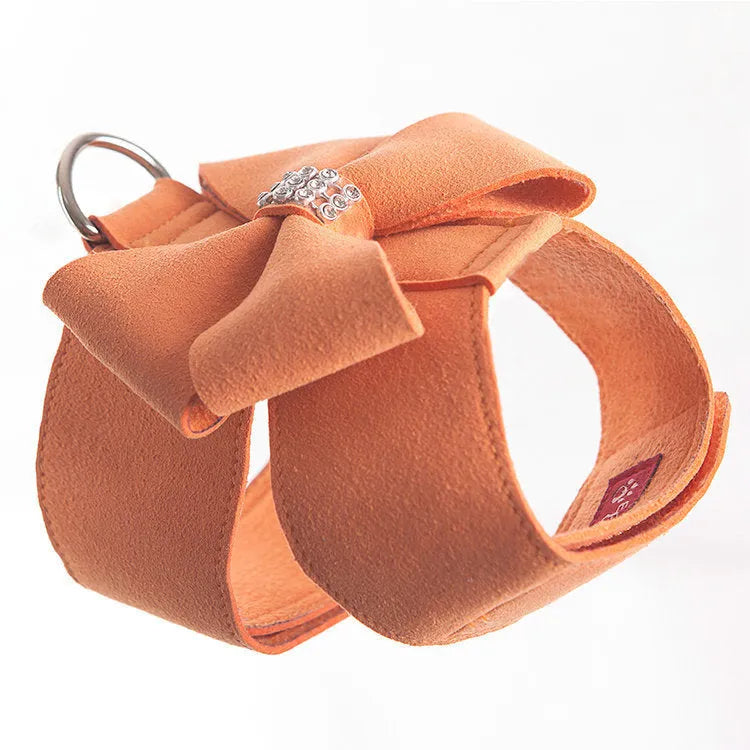 A soft microfiber dog chest strap with a decorative bowknot, shown in pink, blue, and orange colour options.