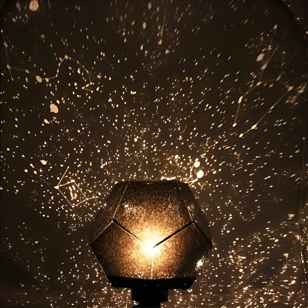 LED star projector night light showing constellation projection on a dark ceiling