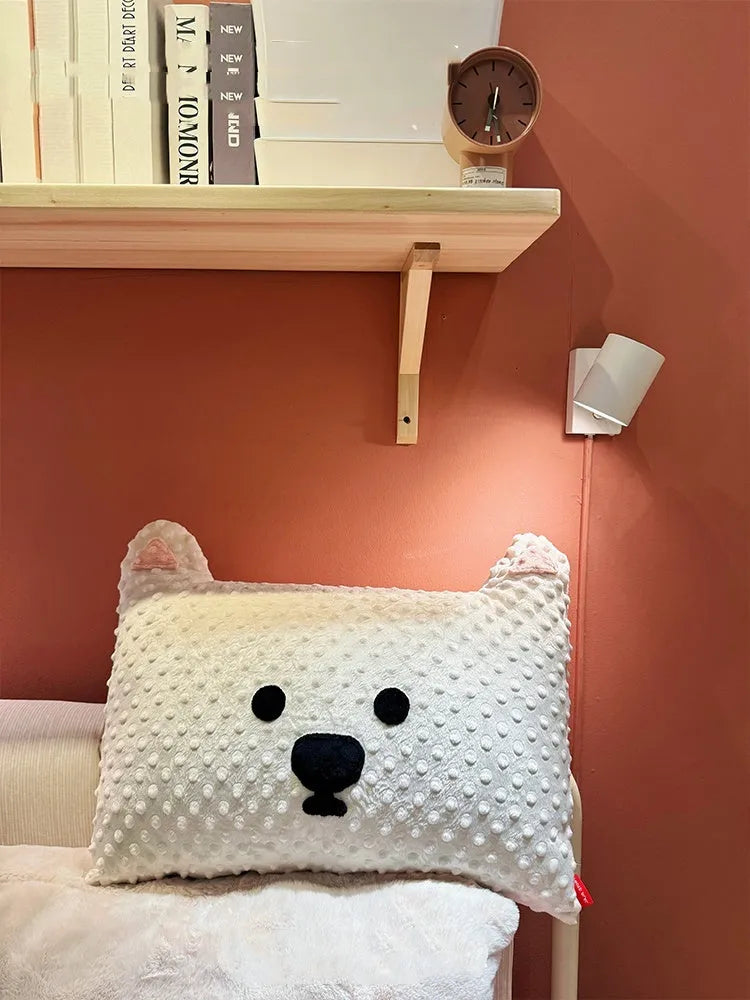 Grey and white decorative dog pillow with Schnauzer print on a sofa