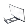 12 inch mobile screen magnifier with curved arc frame holding a phone in anti-slip slot on a desk