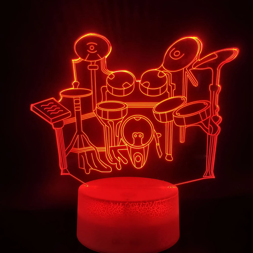 Drum kit 3D night light with seven colour modes, acrylic board, and ABS base on a desk