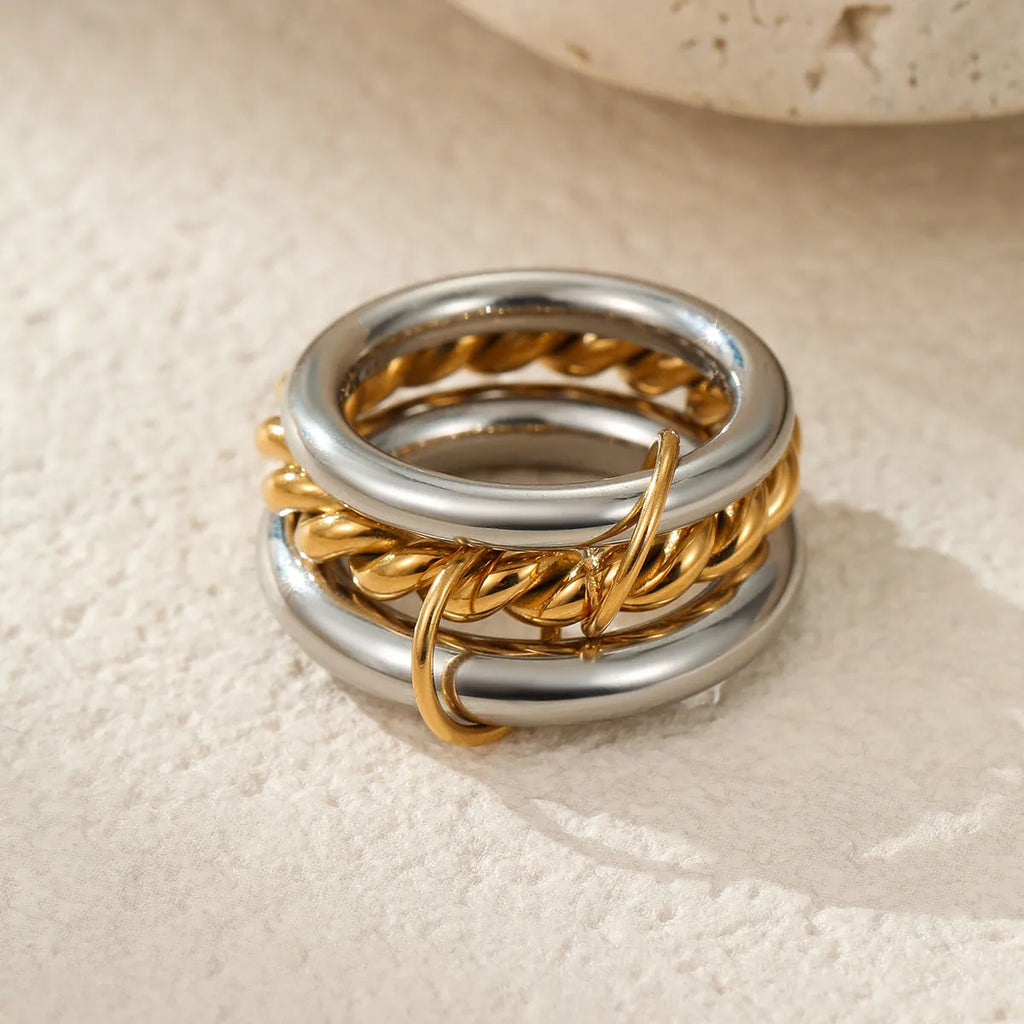 Three stacked stainless steel rings with 18K gold plating in matching design