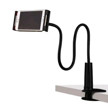 Black bedside oversize flat panel mobile phone stand with long flexible arm extended on a wooden table.