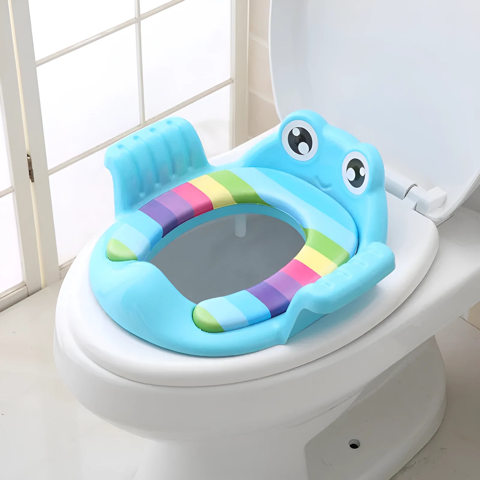 Pink baby toilet seat with adjustable non-slip pads for toddlers aged 1-6 years on a toilet bowl