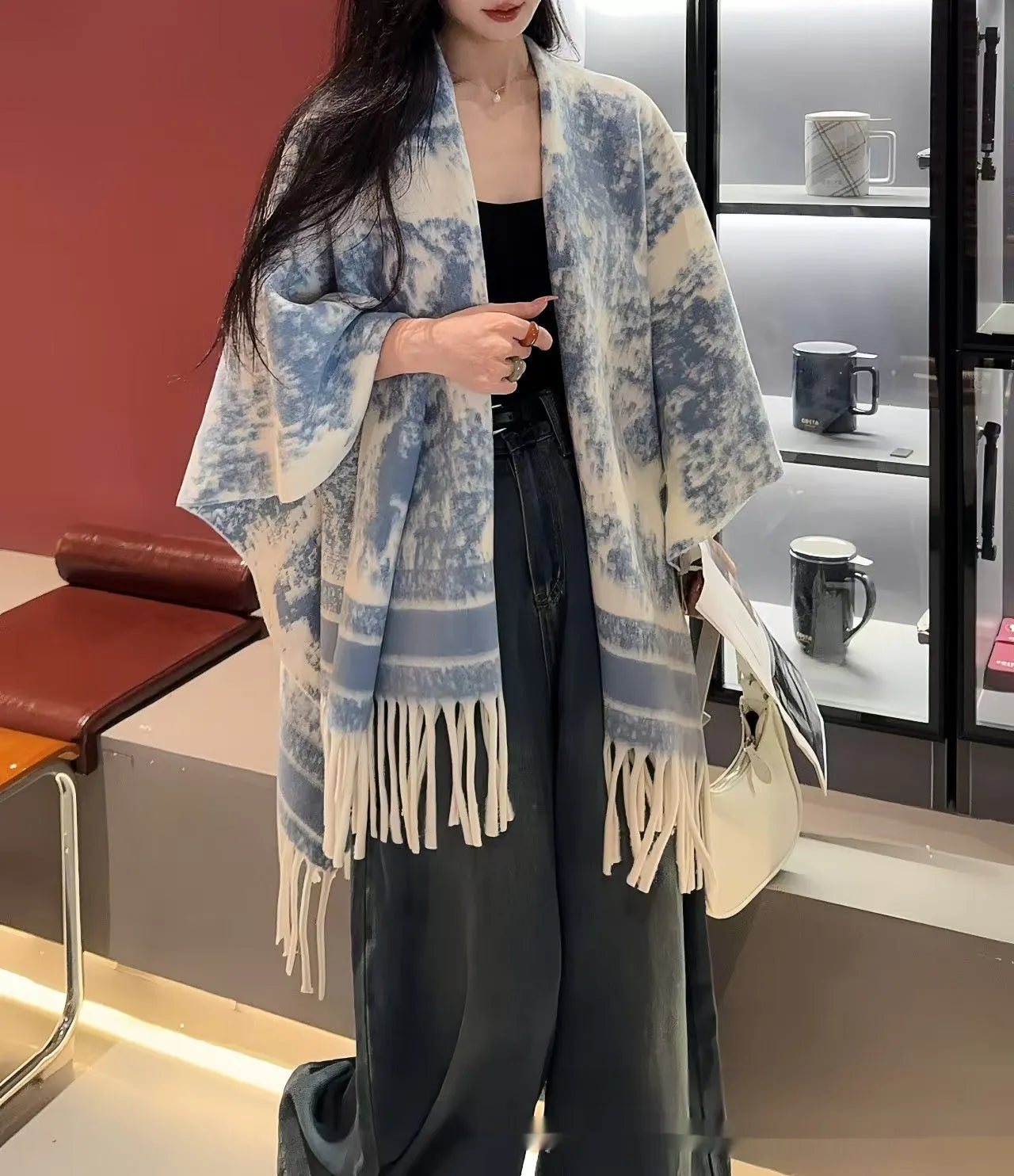 Women's polyester tassel-trimmed scarf cape draped over shoulders