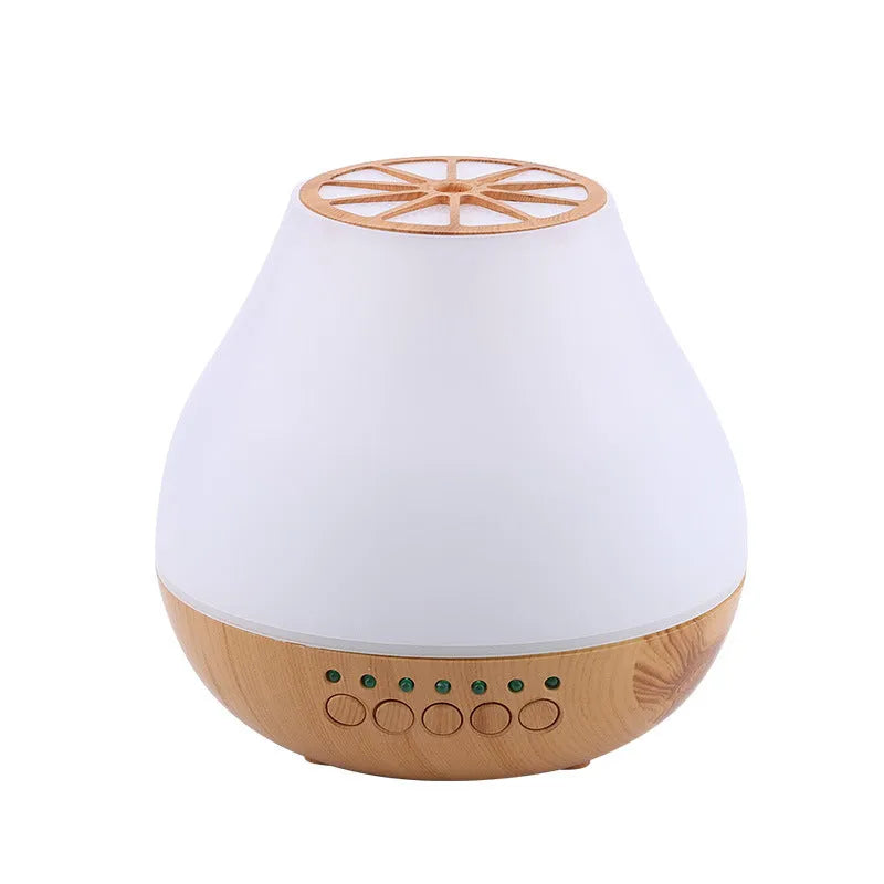 USB ultrasonic aroma diffuser with wood grain finish and colourful light on a wooden desk