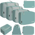 Eight PP material cubic travel packing bags in various solid colours for luggage organisation