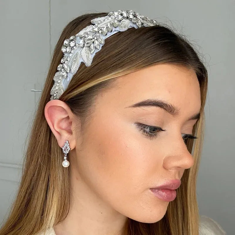 Geometric floral design earrings with micro inlaid zircon detail in gold, platinum, or rose gold plating.