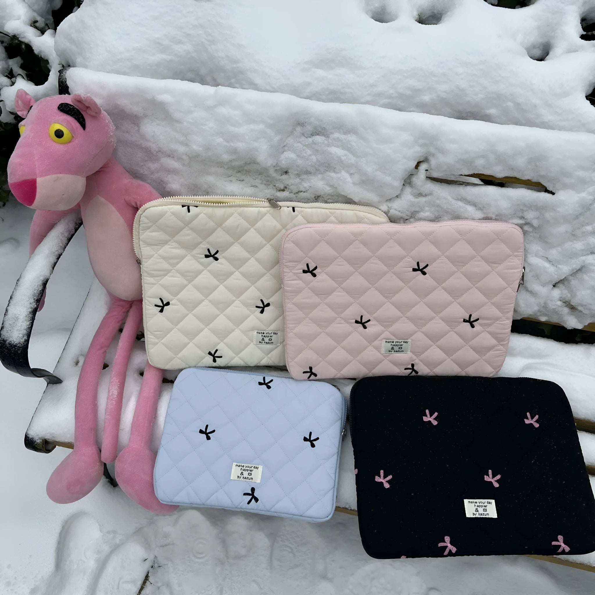 Rhombus embroidered bow design on nylon laptop storage bag showing colour and size options