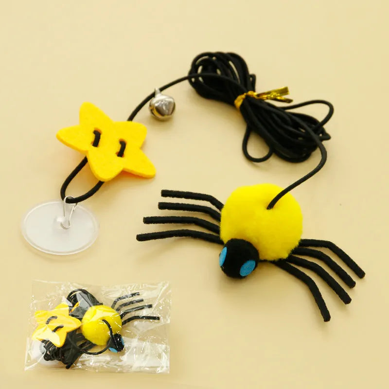 Cat hanging door toy with elastic rope featuring feather, bell and spider attachments in red or yellow colours