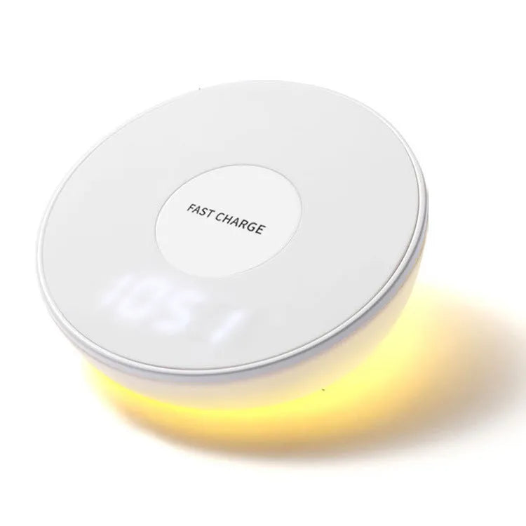 White wireless charger with digital clock display showing time and charging smartphone