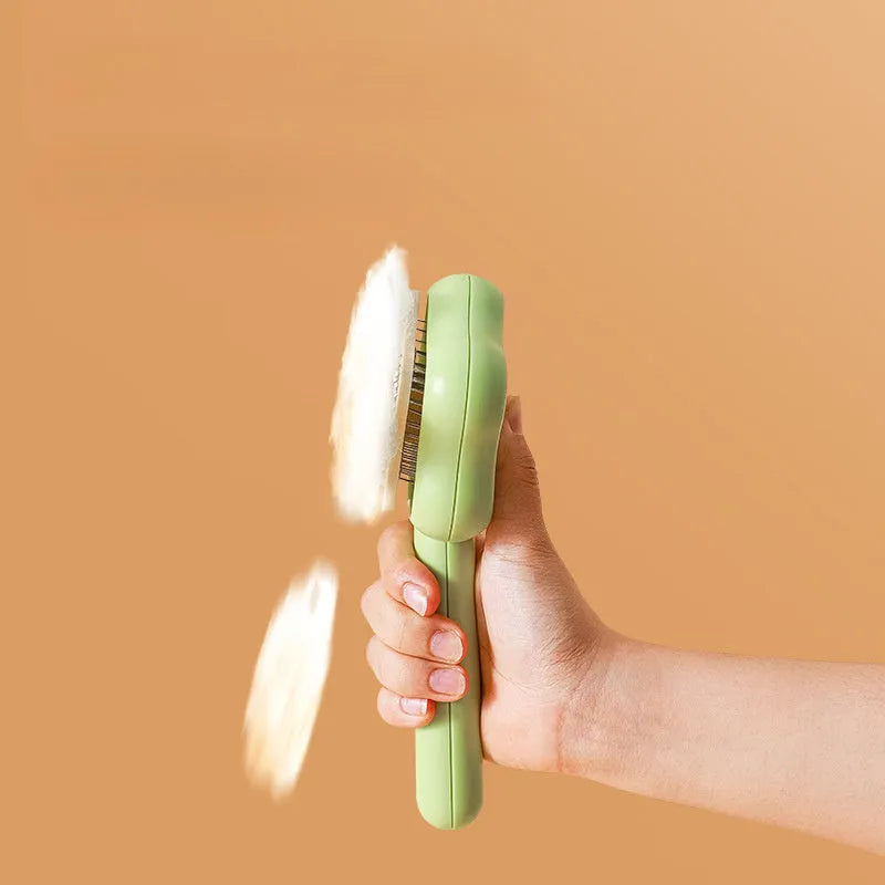 Self-cleaning stainless steel needle cat comb with magic wand handle in green or yellow
