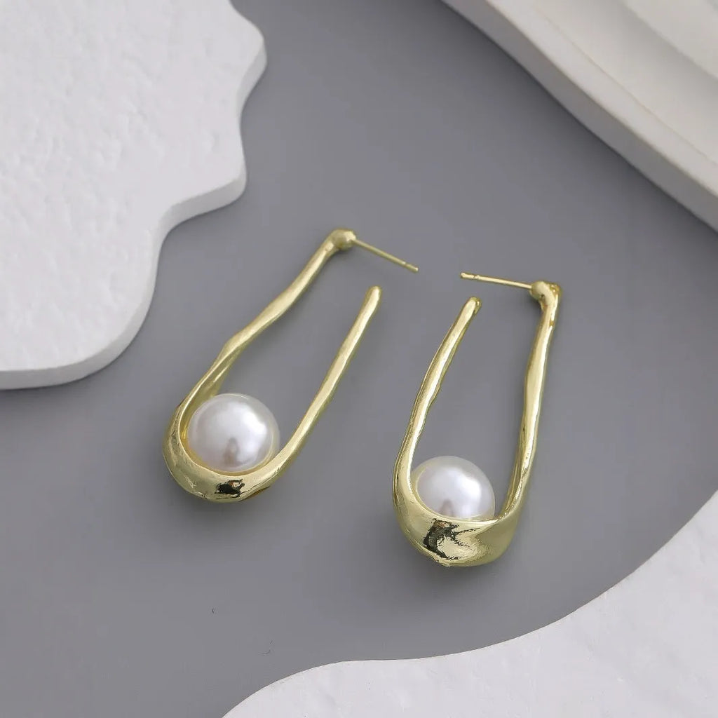 Vintage irregular pearl clip-on earrings in gold colour for women, fashion accessory