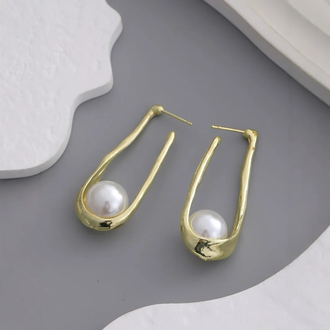 Vintage irregular pearl clip-on earrings in gold colour for women, fashion accessory