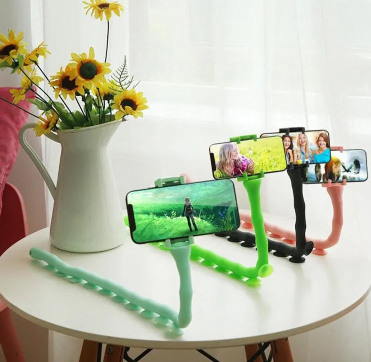 Black flexible rubber phone holder with suction cup base bent into an L-shape