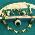Gold plated zircon jewellery set with necklace, earrings, ring, and bracelet on display.