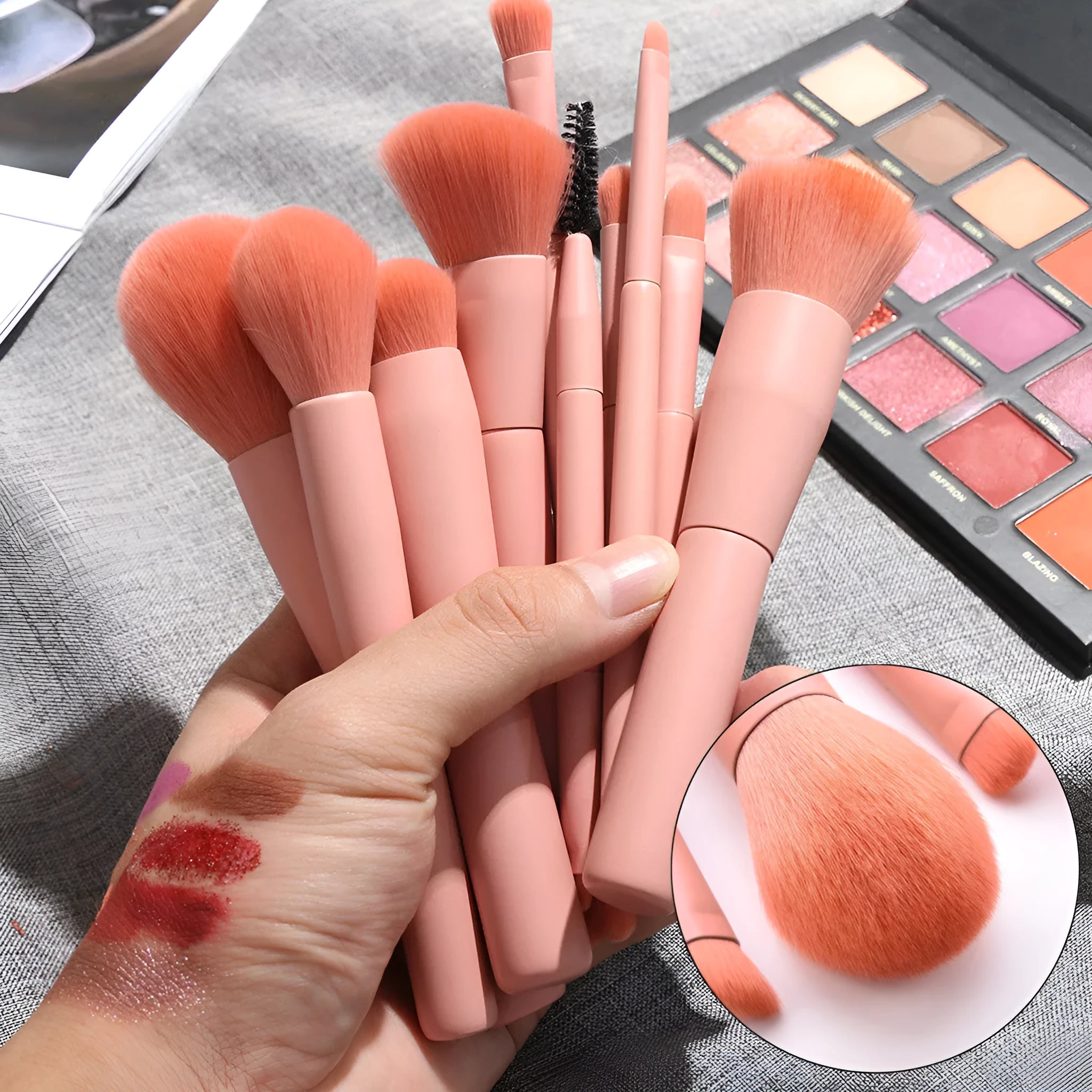 Ten cosmetic makeup brushes with wooden handles arranged showing various brush head shapes and sizes
