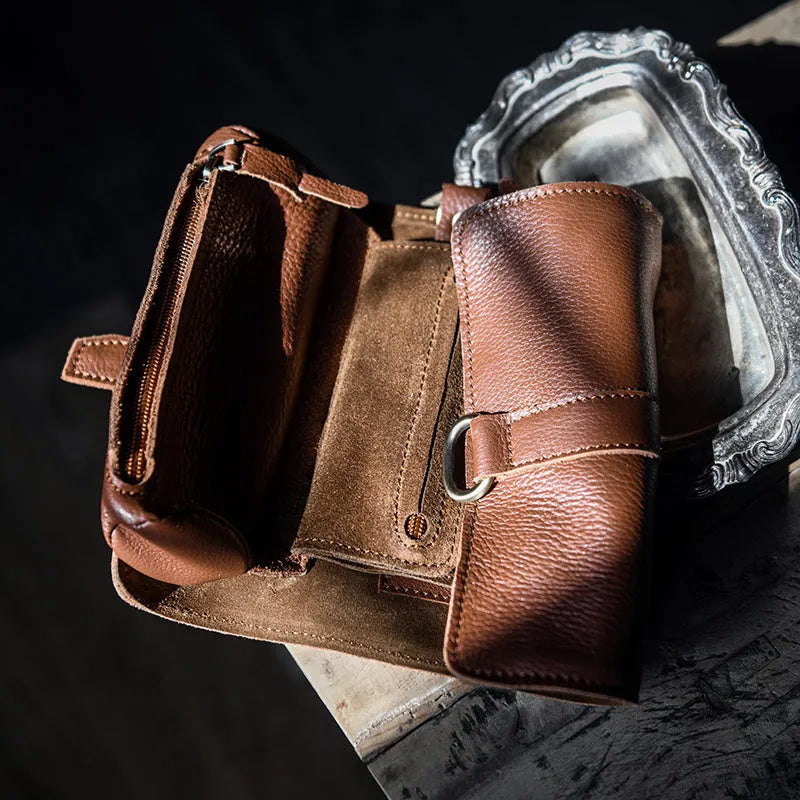 Handmade cow leather vintage wallet in black, showing tape extraction closure.