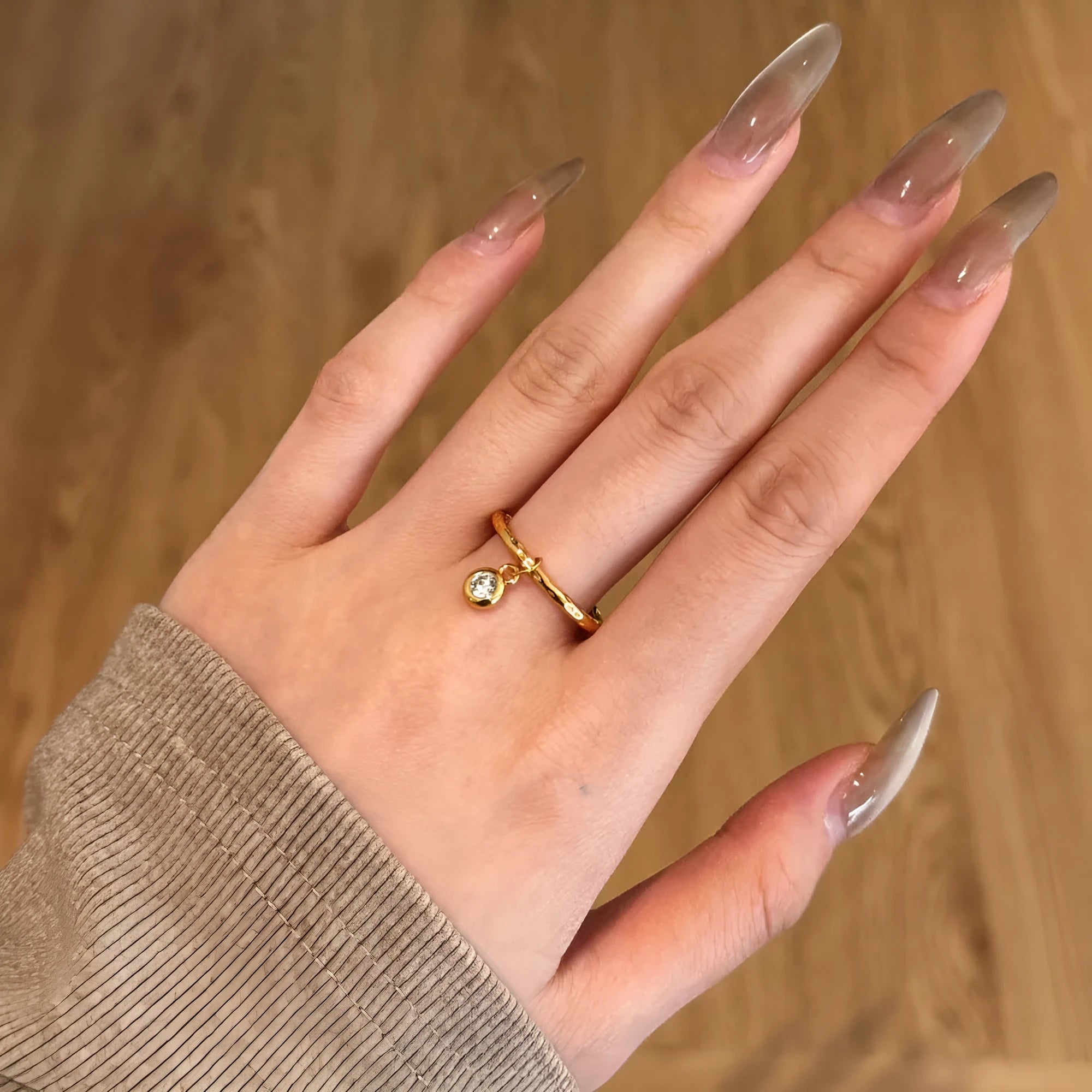 Women's silver ring with pleated texture in electroplated gold finish, available in sizes No 6 to No 8