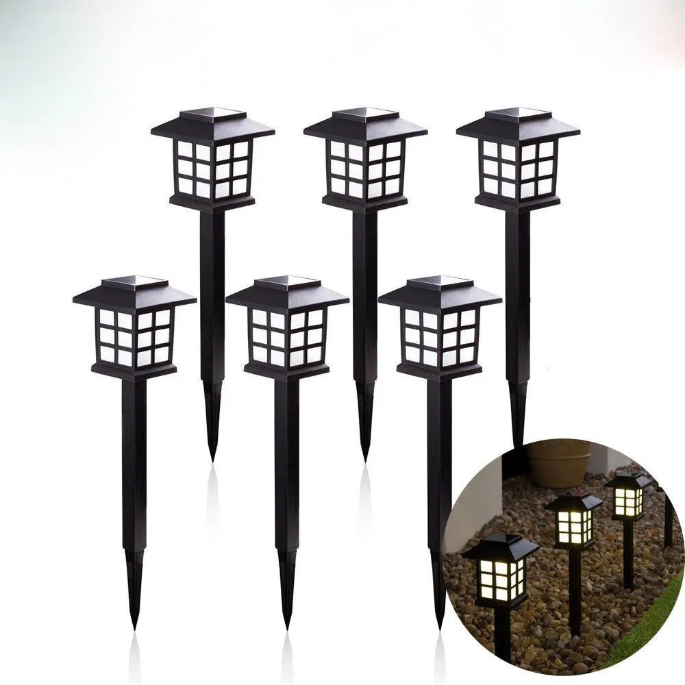 Solar square lawn light with LED, IP44, in a garden setting showing white light illumination