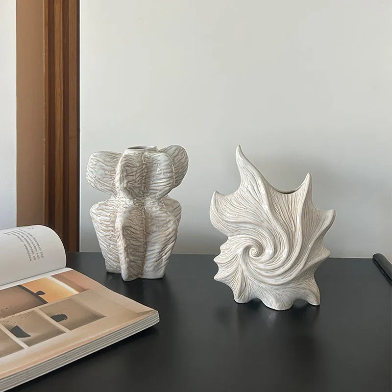 A European style retro ceramic vase with a coloured glaze finish, shown on a shelf.