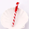 Four Christmas-themed erasable gel pens in a sleeve: Santa, gingerbread man, elk, and snowman designs