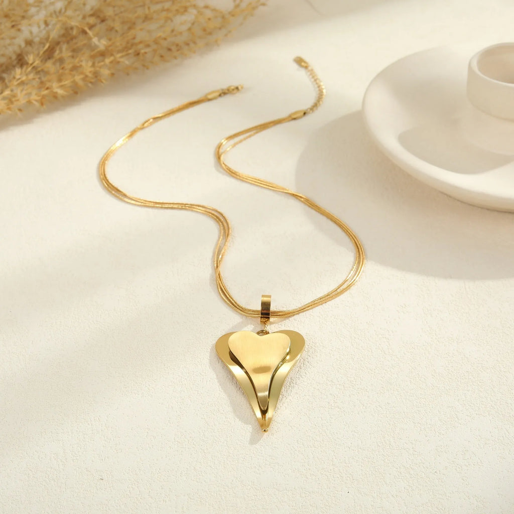 Women's stainless steel necklace with geometric double heart snake bones pendant in gold or steel finish