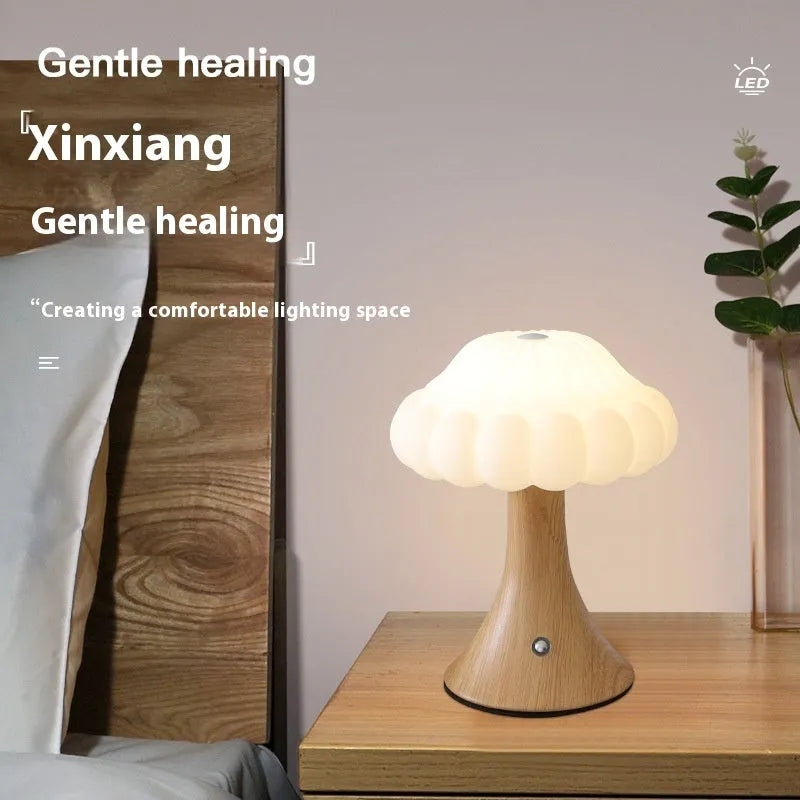 Wood grain finish mushroom-shaped touch night lamp on a table