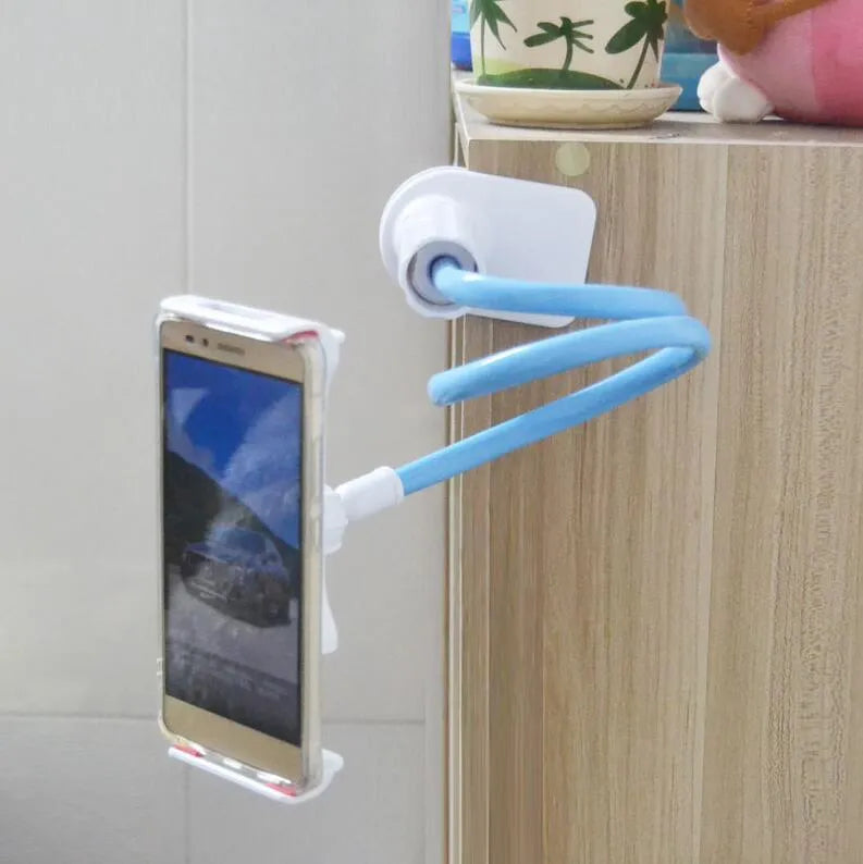 Black bedside oversize flat panel mobile phone stand with long flexible arm extended on a wooden table.