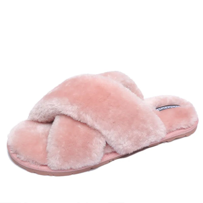 Women's black cross open-toe fur slippers showing patterned non-slip sole and soft interior