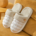 Plaid patterned EVA detachable slippers with plush lining, shown in pink, on a plain background.