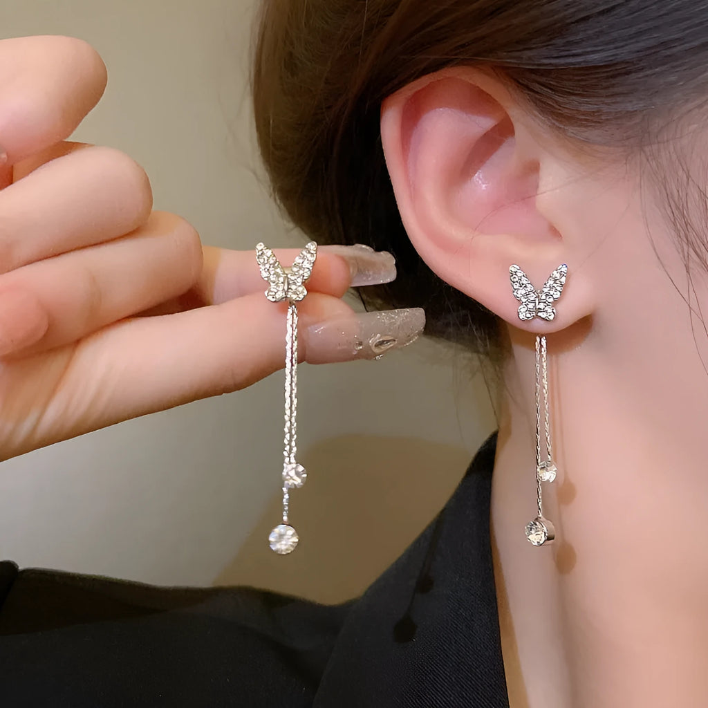 Silver alloy butterfly tassel earrings with geometric design, fresh style, on white background
