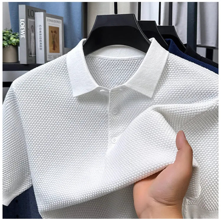 Loose fit grey cotton short sleeve pullover sweater laid flat.